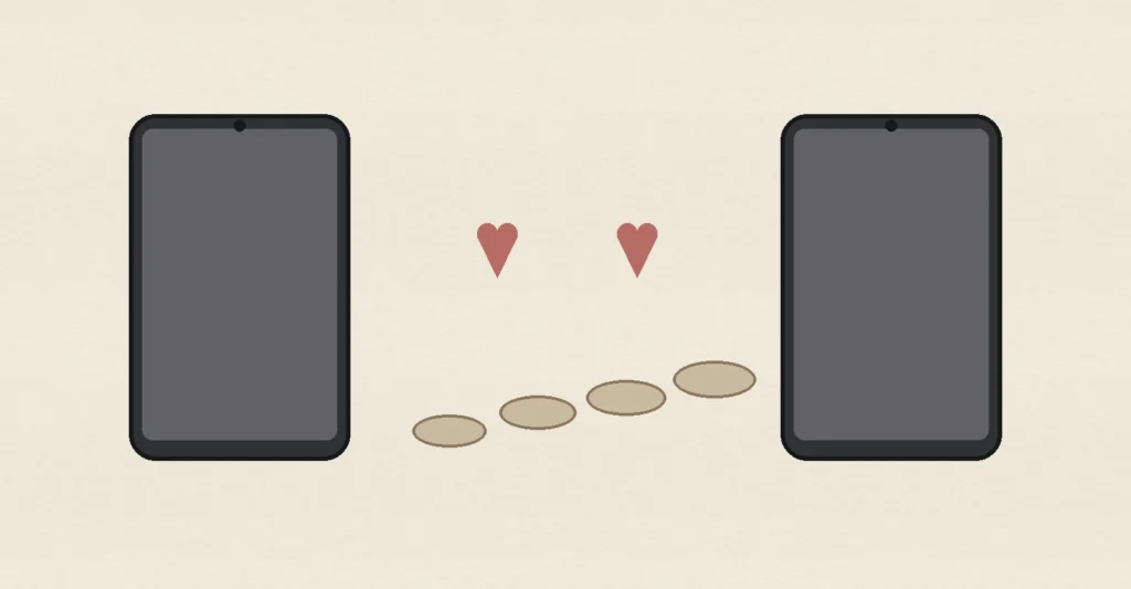 Two blank smartphones, matching hearts and stepping stones, representing online dating, known-person attraction and different paths to finding a compatible partner.
