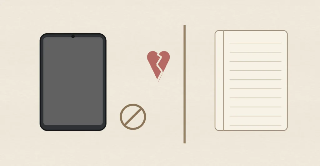 A blank smartphone, cracked heart, boundary line and notebook, representing heartbreak healing, reduced social media checking and healthy post-breakup boundaries.